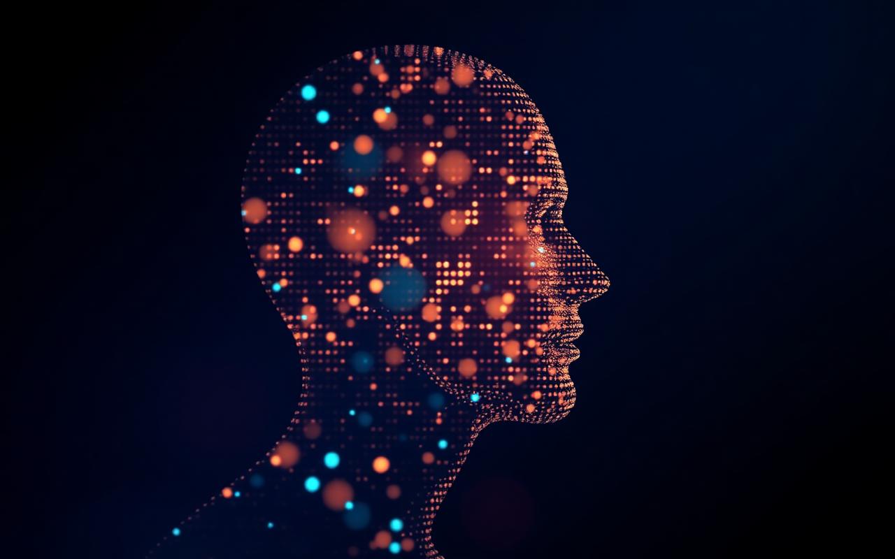 An abstract portrait made of glowing dots forming the vague outline of a head silhouette in profile against dark blue